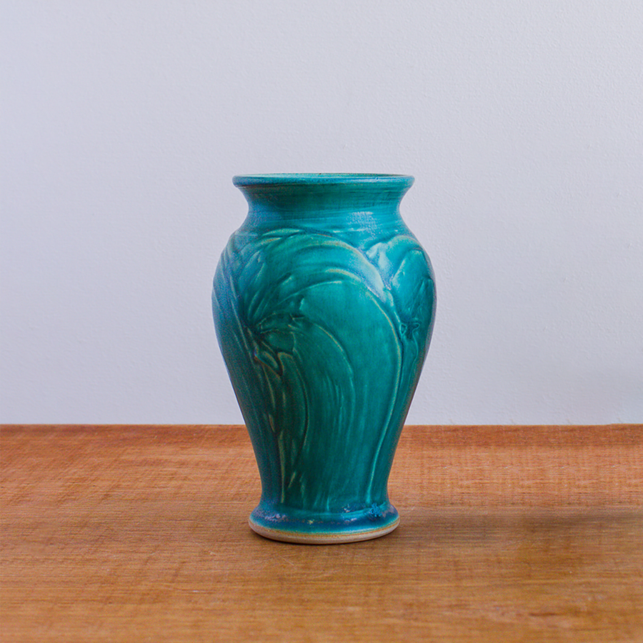 This vase features the matte turquoise Pewabic Blue glaze.