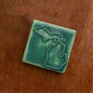 This Michigan Tile features the matte blueish-green Pewabic Green glaze.