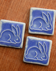 This ceramic Bunny Tile is featured in the matte Periwinkle glaze.