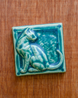 This cat tile is shown in a matte Pewabic green glaze.