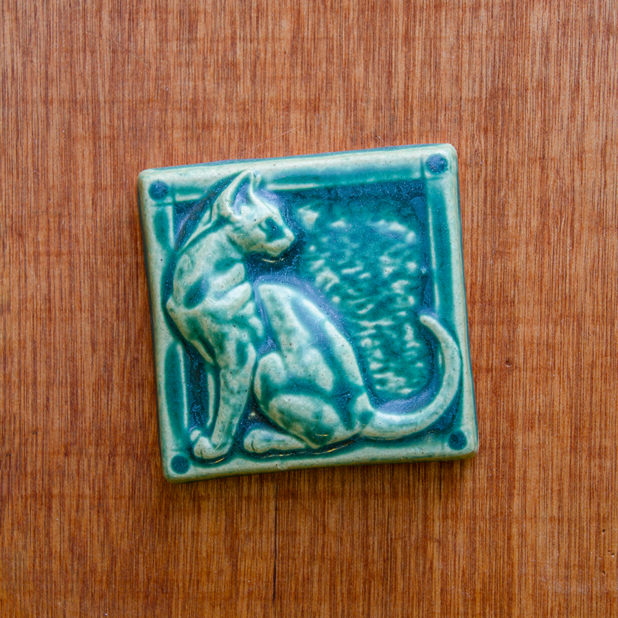 This cat tile is shown in a matte Pewabic green glaze.