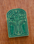This tile features the matte blueish-green Pewabic Green glaze.