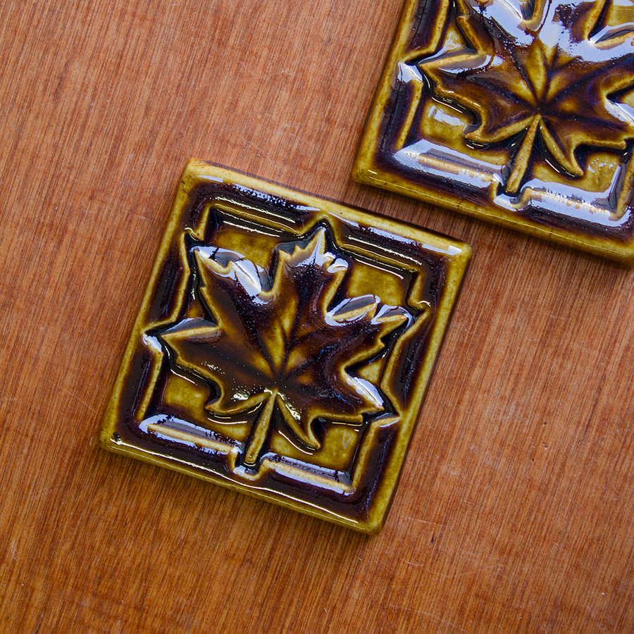 This Maple Leaf Tile features the glossy earthy brown Molasses glaze.