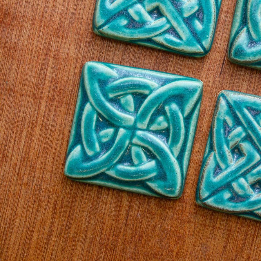 This Lover's Knot features the matte turquoise Pewabic Blue glaze.