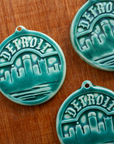 This Detroit Ornament features the matte blueish-green Pewabic Green glaze.