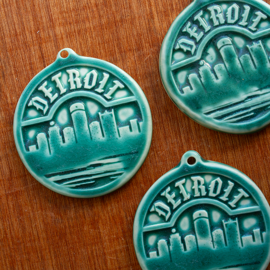 This Detroit Ornament features the matte blueish-green Pewabic Green glaze.