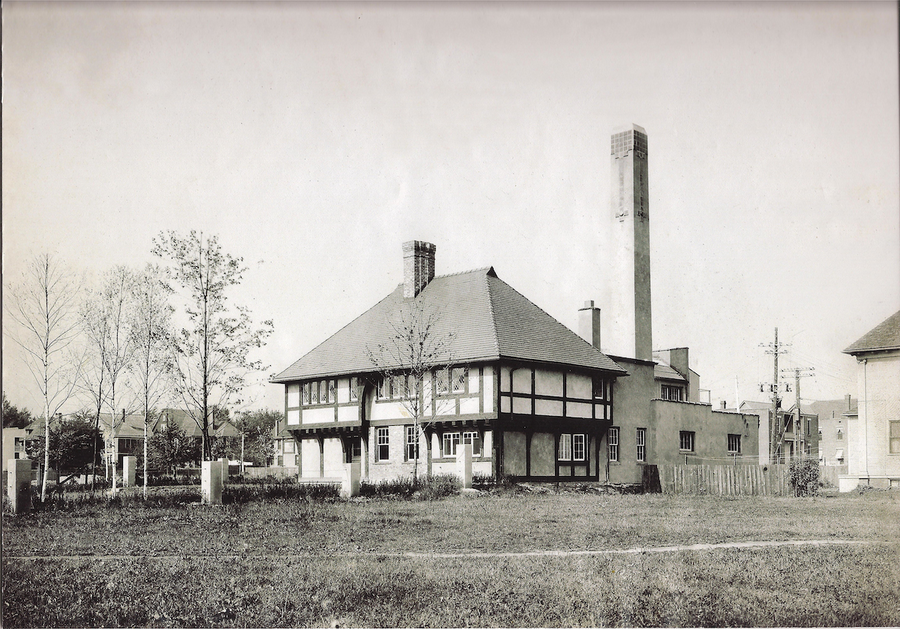 A historic black and white image of the pottery building.