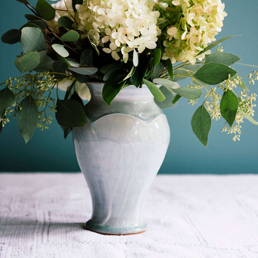 This Classic Vase features the glossy pale blue-gray Frost glaze. A close-up of the Frost glaze shows crazing on its surface- this gives the appearance of tiny cracks on the glaze's surface.