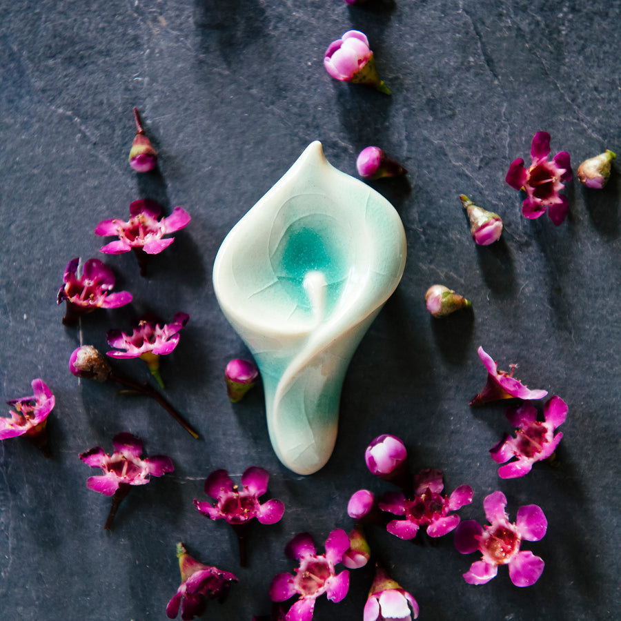 Ceramic Calla Lily Pin in pale glossy blue glaze.