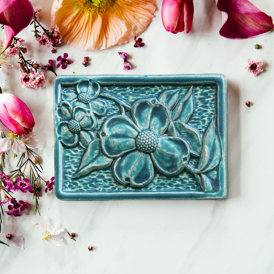 This Dogwood Tile features the matte turquoise Pewabic Blue glaze.