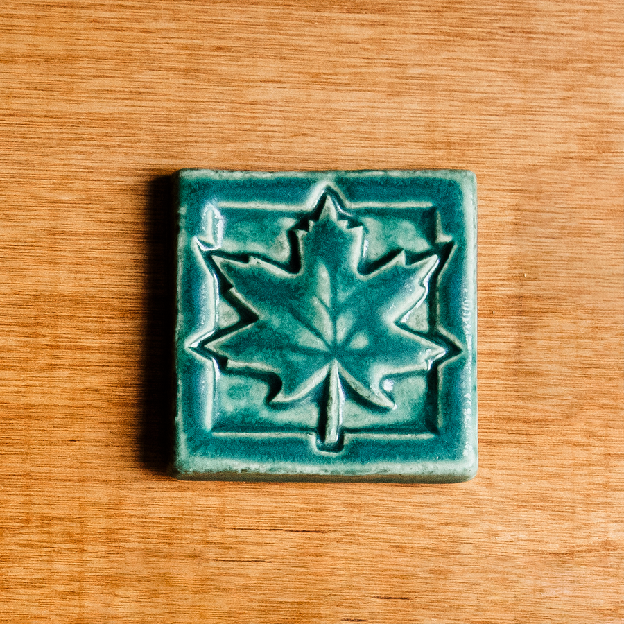 This Maple Leaf Tile features the matte blueish-green Pewabic Green glaze.