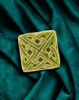 This Eternity Knot Tile features the matte bright light green Lime glaze.