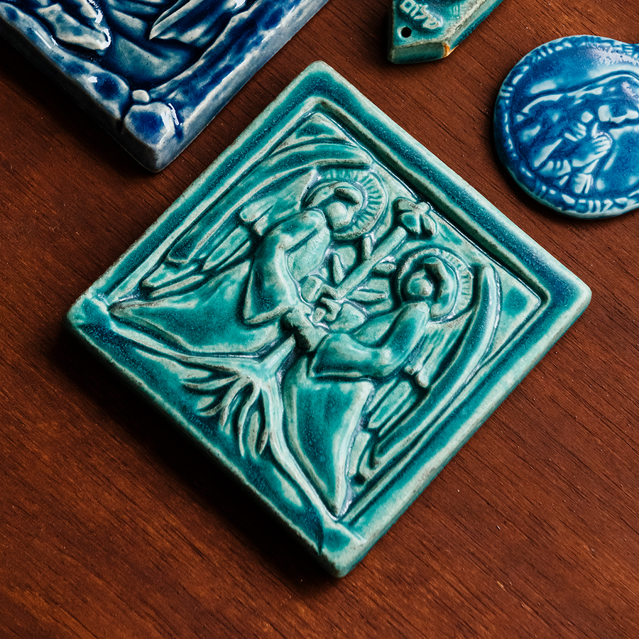 This Two angels tile features the matte turquoise Pewabic Blue glaze.