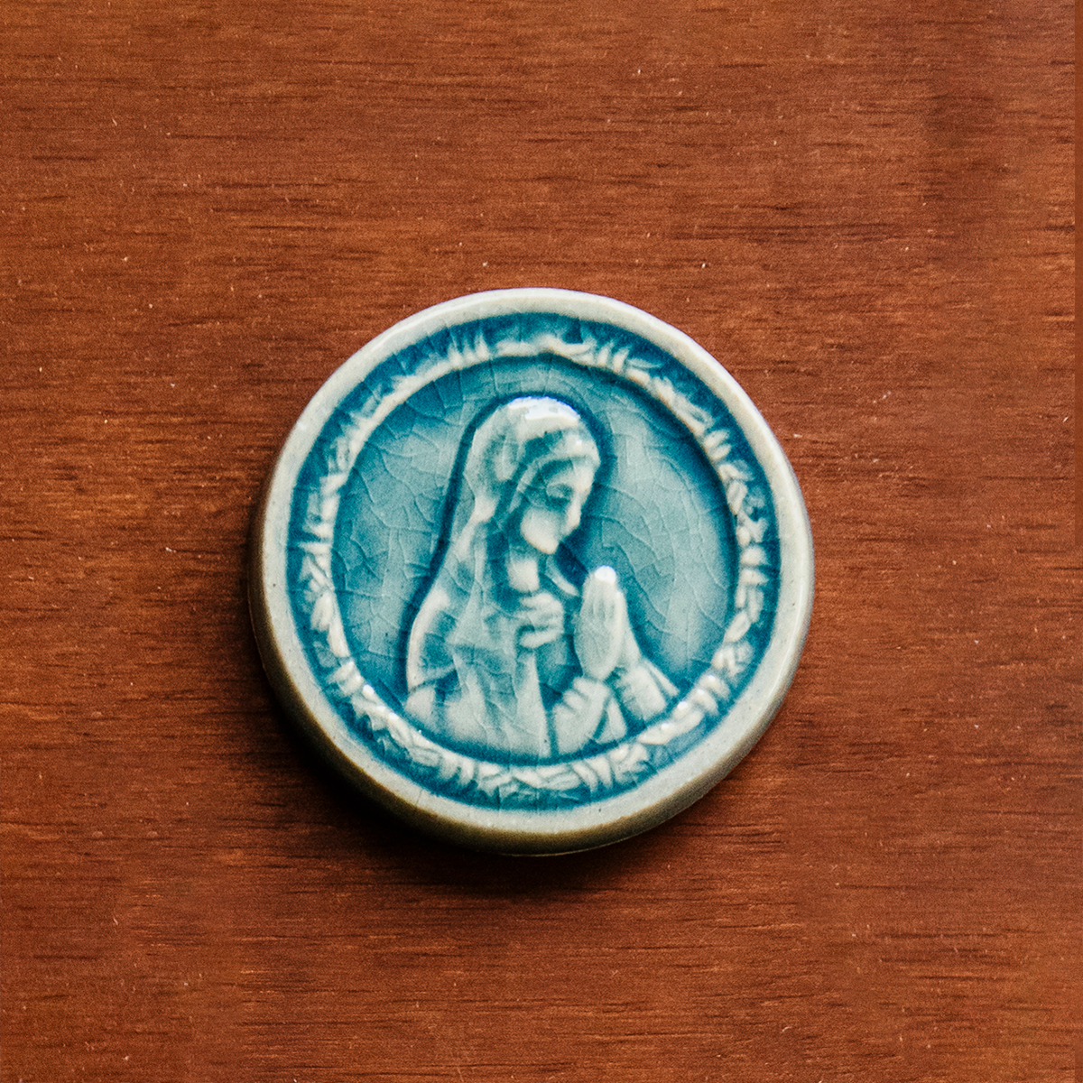 This ceramic Blessed Virgin Mary Tile is glazed in a pale blue, glossy Glacier glaze.