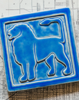 The right-facing Lion tile in the Sky glaze sits on a black and white map of Detroit.