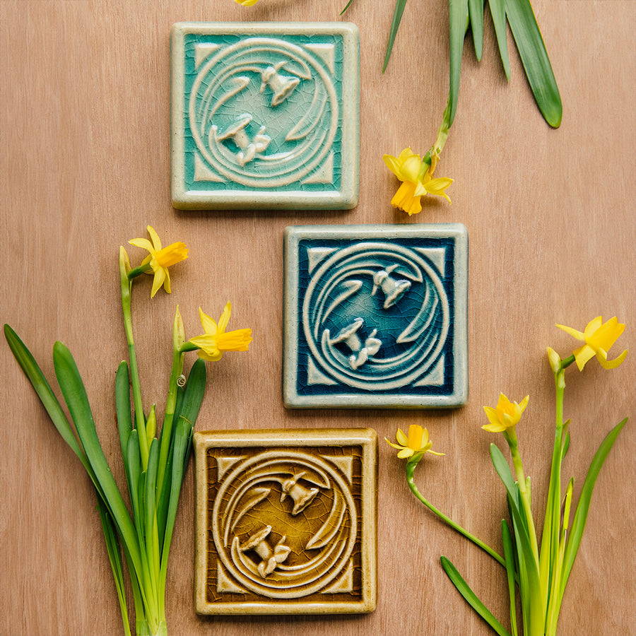 All three Daffodil color options are hung together with real daffodils surrounding them.