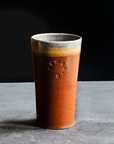 This Pint features the matte brownish-red tones of the Cinnamon glaze with a gray interior and lip.