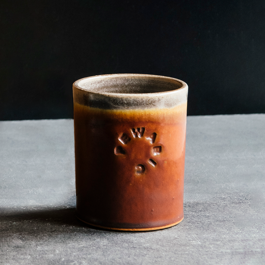 These Rocks cups feature the matte reddish-brown Cinnamon glaze. The inner lining and lip of the cup have a speckled gray.