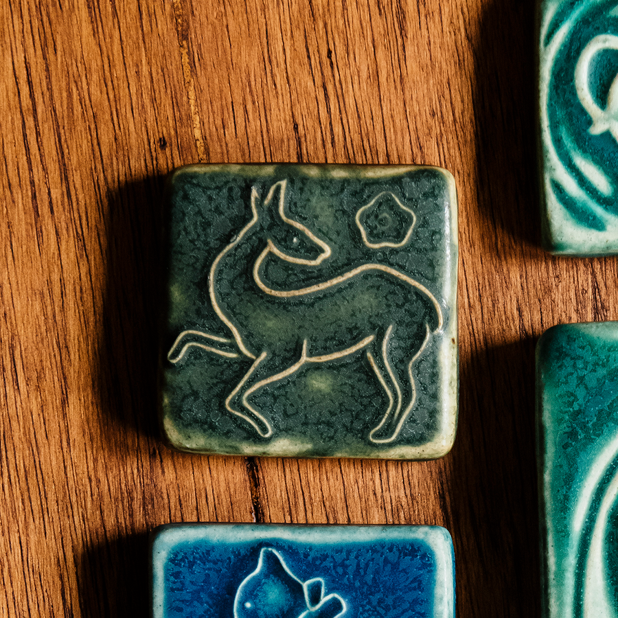 This tile features the matte dark mossy green Bayleaf glaze.