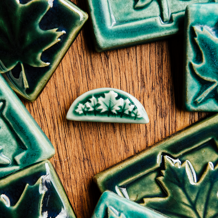 This pin features our glossy green Emerald glaze.
