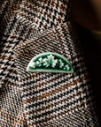 The green tones of the Maple Leaf Pin are a perfect contrast pinned to a black and brown houndstooth blazer.