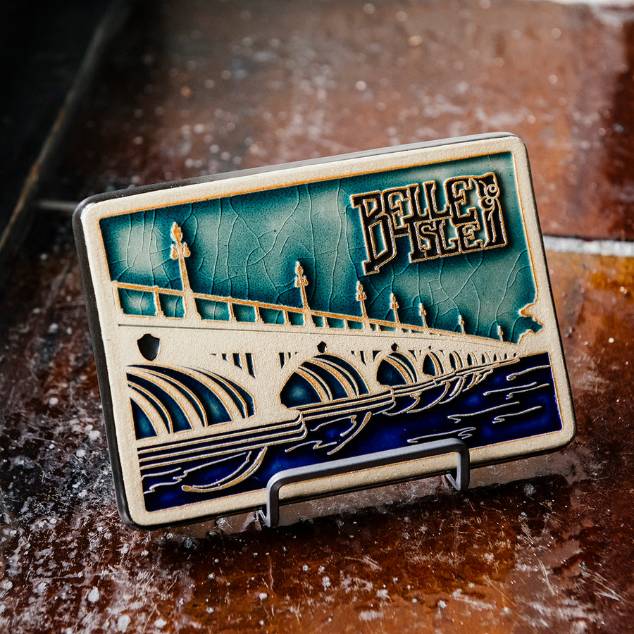 3" matte silver tile stand holding our hand-painted Belle Isle Bridge Tile.