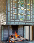 A detail shot of the fireplace from the front featuring our Matte Green Iridescent Scarab Paperweight design.