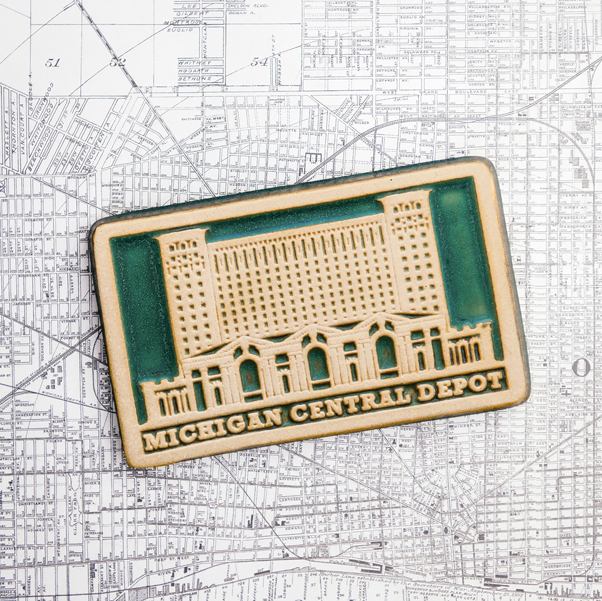 The Michigan Central Depot Tile features the image of the large many-windowed building with the words "Michigan Central Depot" across the bottom of the tile.