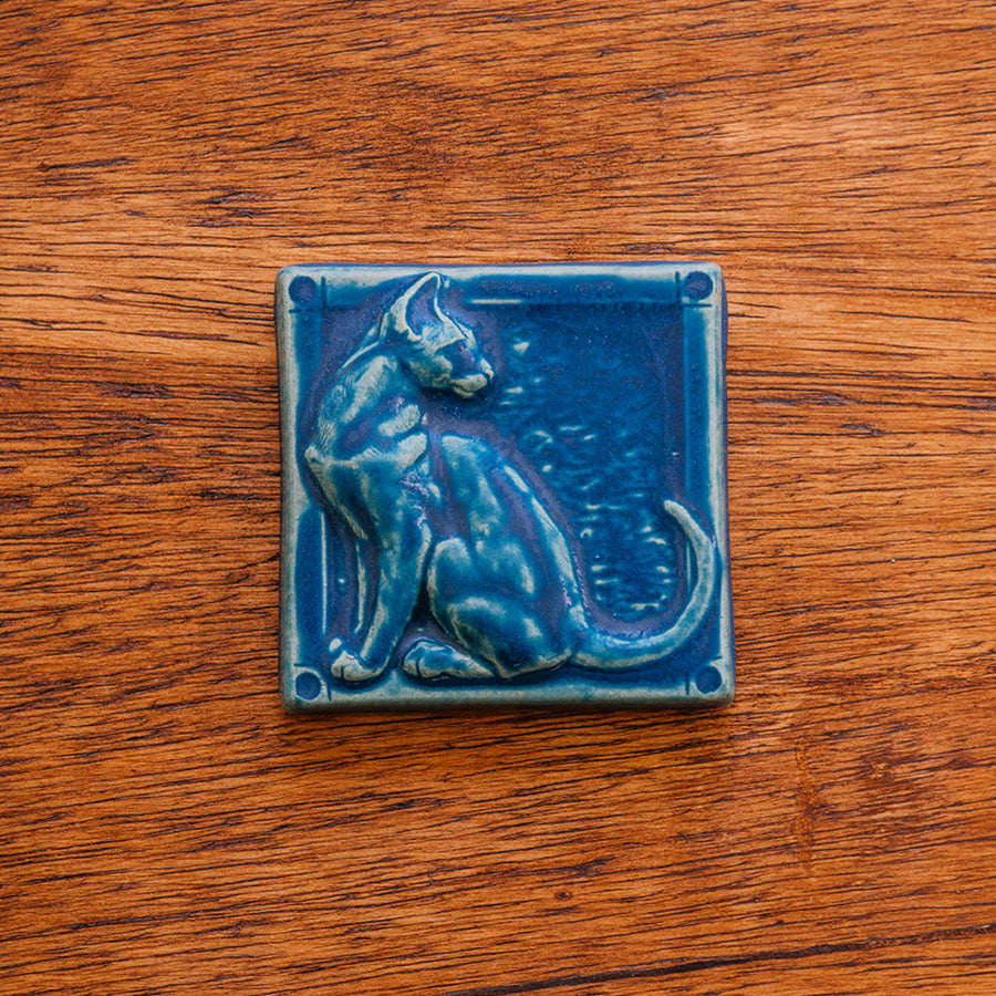 This cat tile is shown in a matte-blue Peacock glaze.