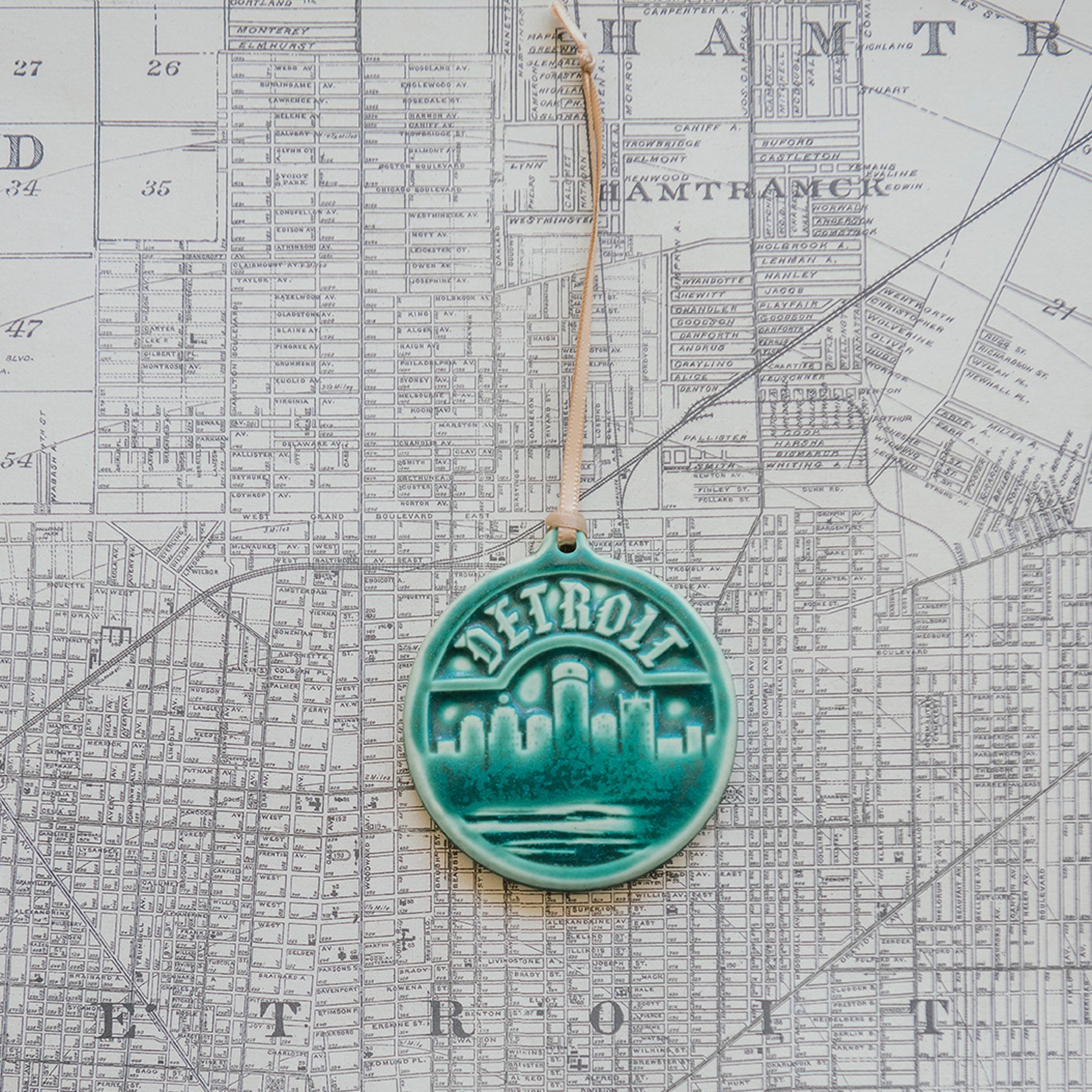This Detroit Ornament features the matte blueish-green Pewabic Green glaze.