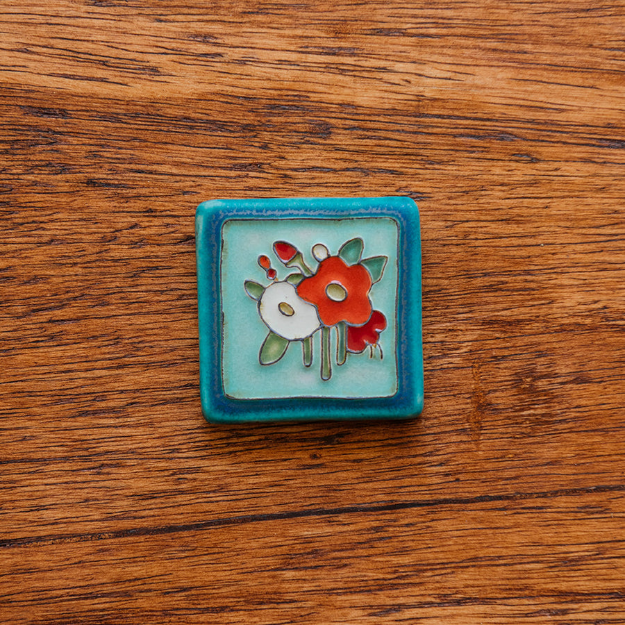 A Hand-Painted Bouquet Tile in our "Poppy Palette."