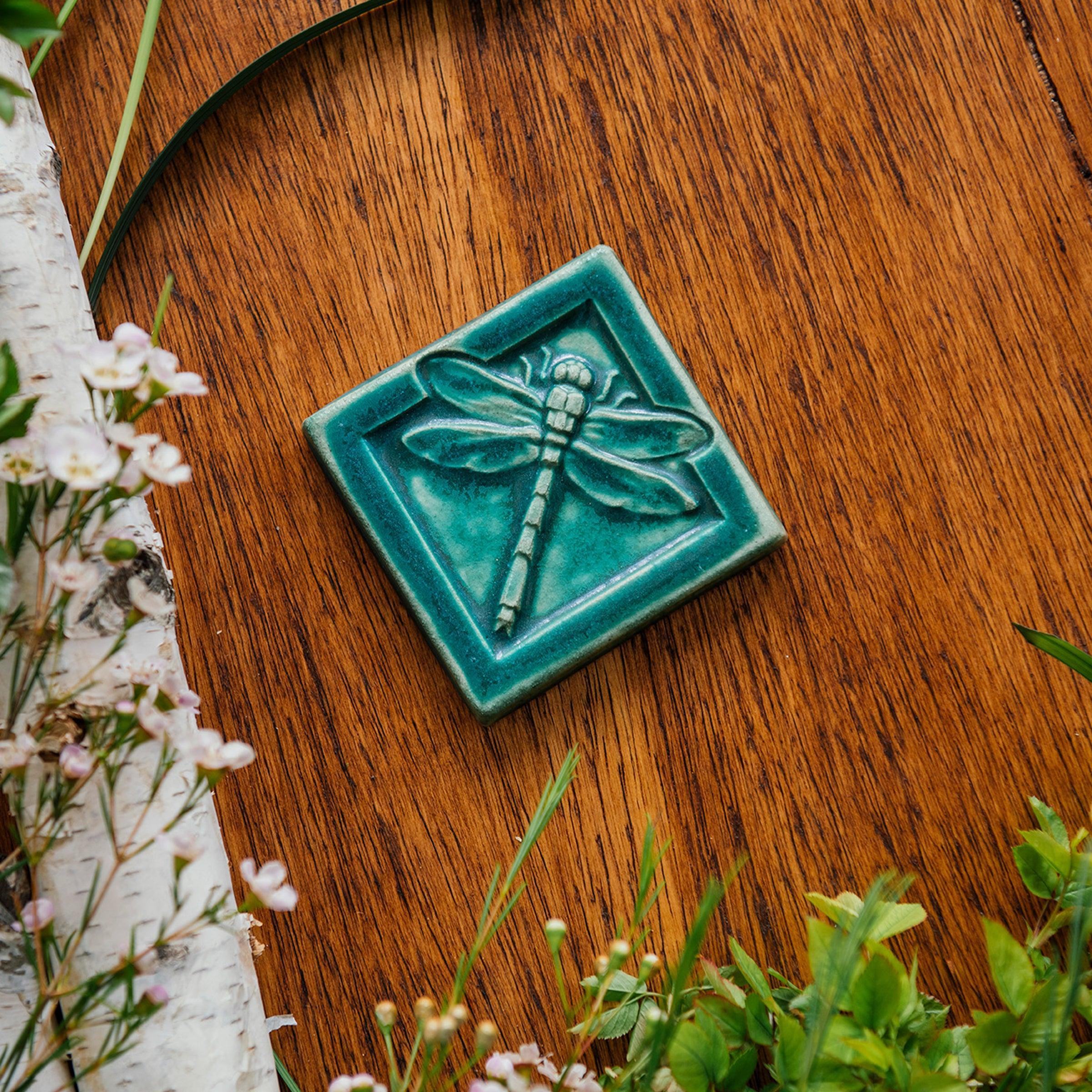 This Dragonfly Tile features the matte blueish-green Pewabic Green glaze.