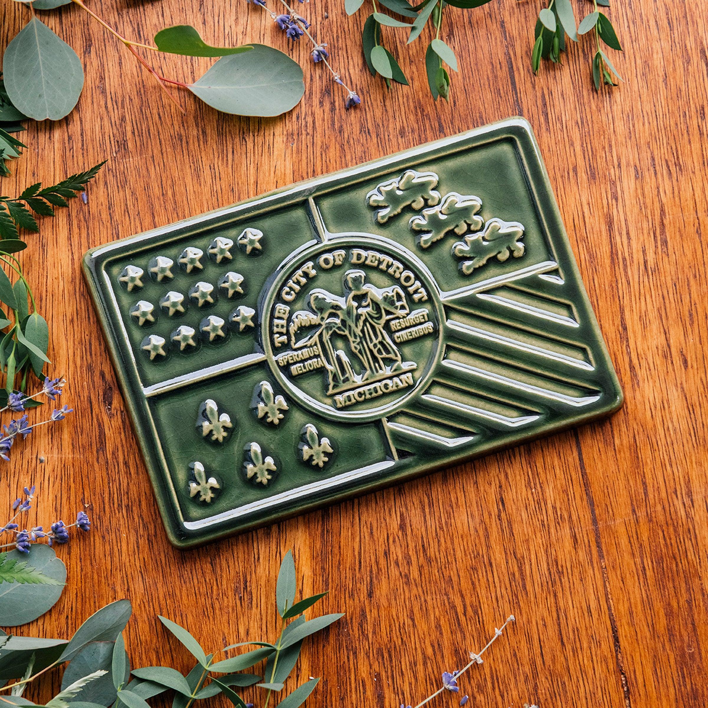 This Detroit Falg tile features the glossy deep green Kale glaze.