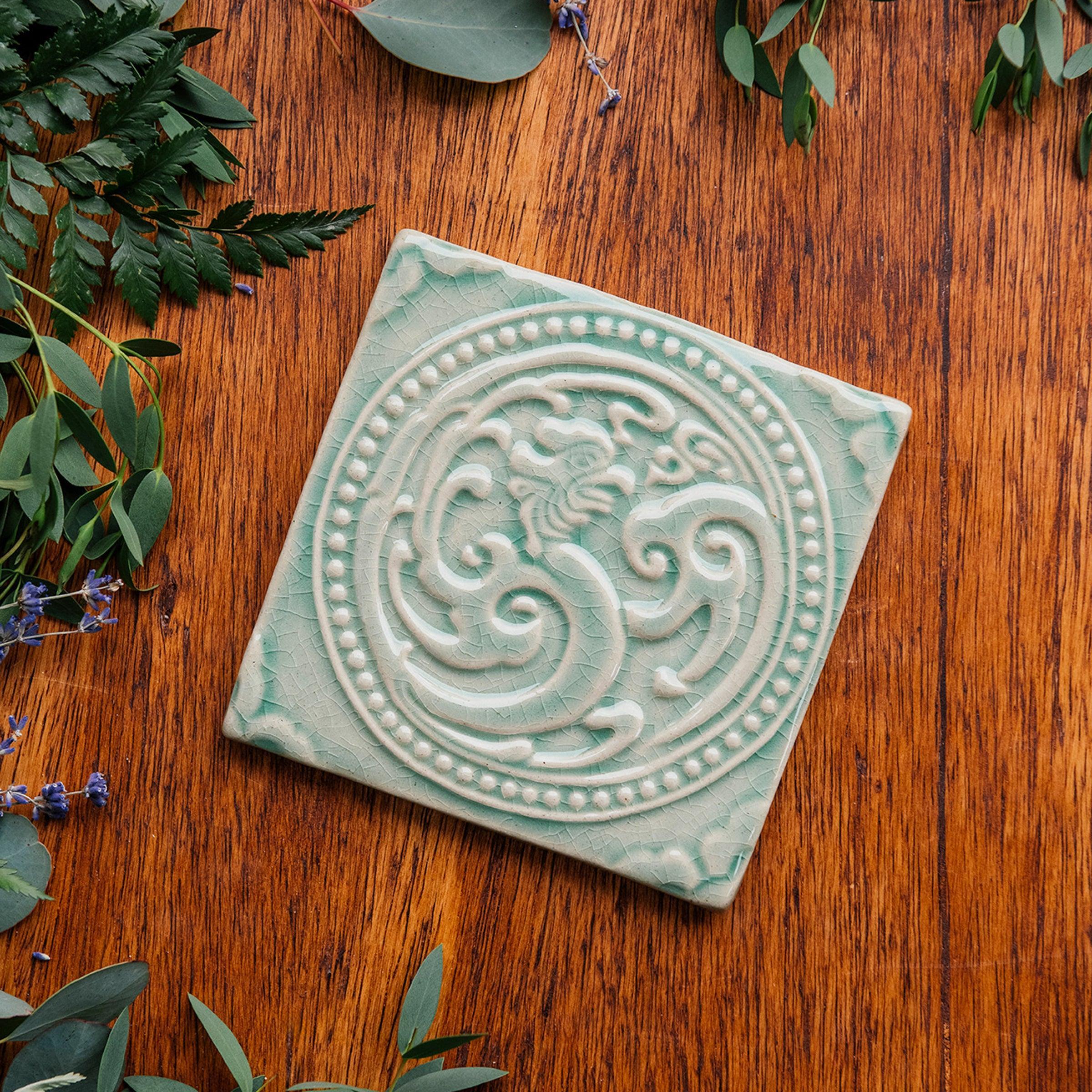 This Phoenix Tile features the glossy pale blue Celadon glaze.