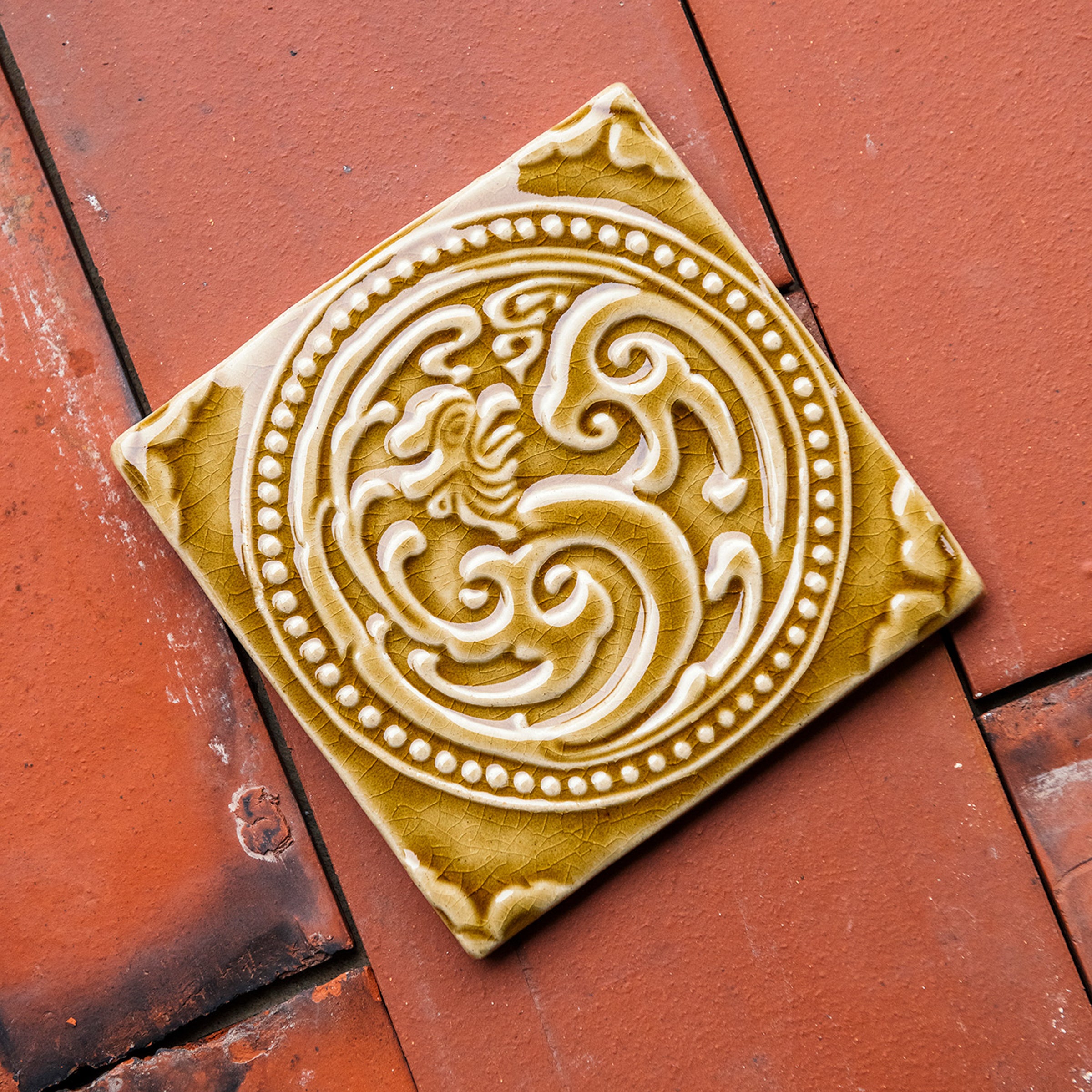 This Honey Phoenix rests on terracotta roof tiles.