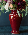 The Large Classic Vase starts with a small diameter at its base that gradually gets larger until it contracts again near the top with a slightly wider lip. The sides of the vase have been swiped with slip, this gives the appearance of abstract petals overlapping on the widest part of the vase.
