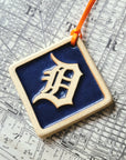 This diamond shaped ornament features the Tigers' logo, an old english style D, in the center with a simple line border around the edge.