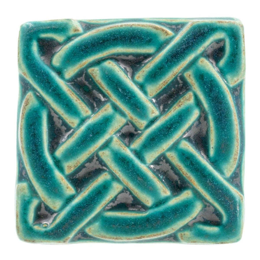 This Journey Knot Tile features the matte turquoise Pewabic Blue glaze.
