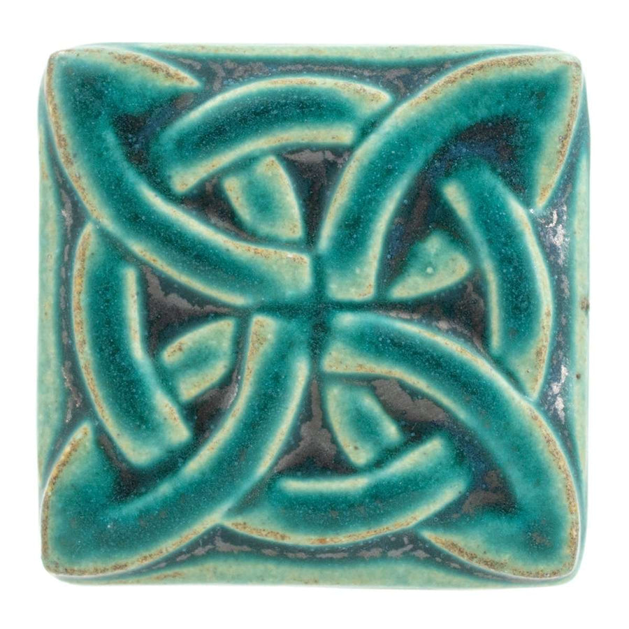 This Lover's Knot features the matte turquoise Pewabic Blue glaze.