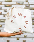 This tote bag features the large Pewabic logo on a creamy white bag.