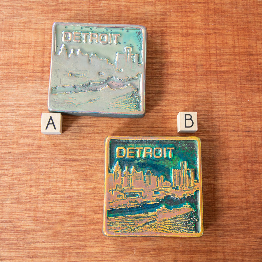 Each Detroit tile has a small wooden cube with either A or B to delineate which tile corresponds to the style option.