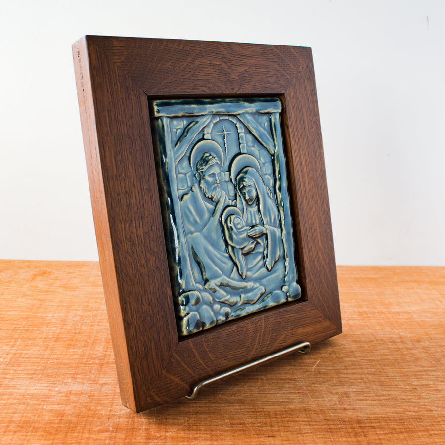 The Framed Nativity Tile sits at an angle, showcasing the glossy nature of the glaze.