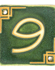 The Craftsman style ceramic 9 address number is in the matte green Leaf glaze option.
