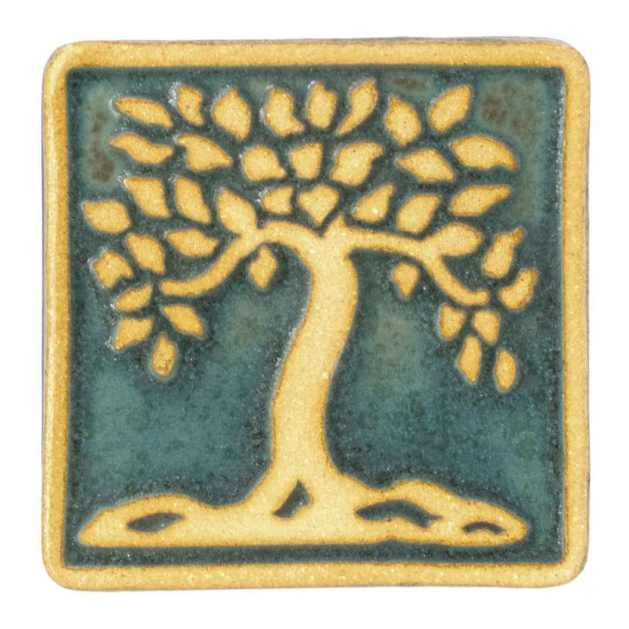 This ceramic viridian/scrape Botanical Tree tile features a plain clay tree and border on a crystalline deep green background.