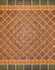 Bayleaf glazed tiles make up the trim of this foyer detail shot with a warm, chestnut glazed center. 