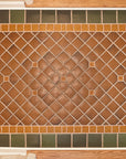 Bayleaf glazed tiles make up the trim of this foyer detail shot with a warm, chestnut glazed center.