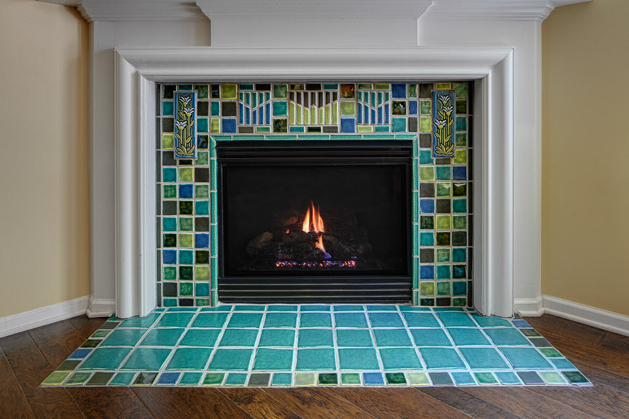 Blended blue and green fireplace and hearth. 