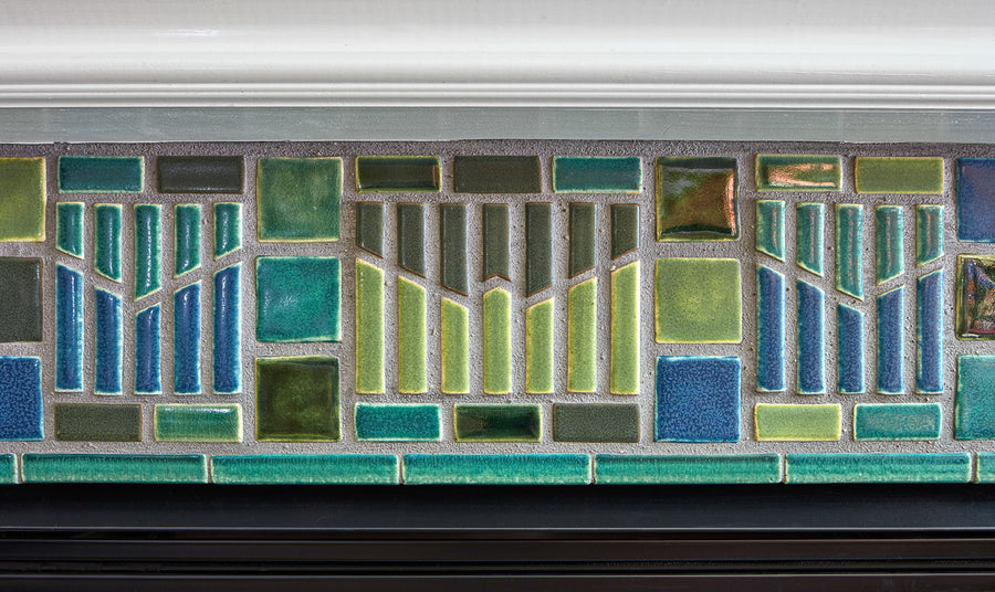 Blended blue and green fireplace and hearth. 