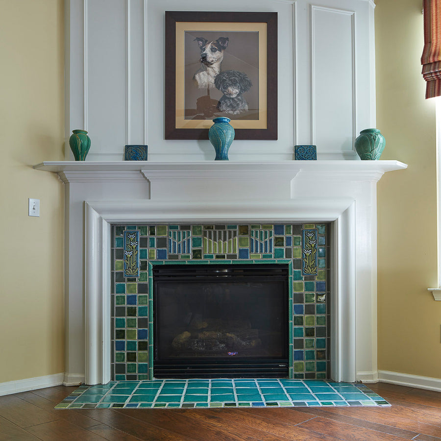 Blended blue and green fireplace and hearth. 