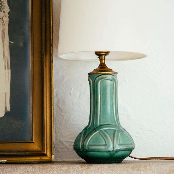 This Celtic Lamp os featured in the matte green Sorrel glaze with the cream lampshade.
